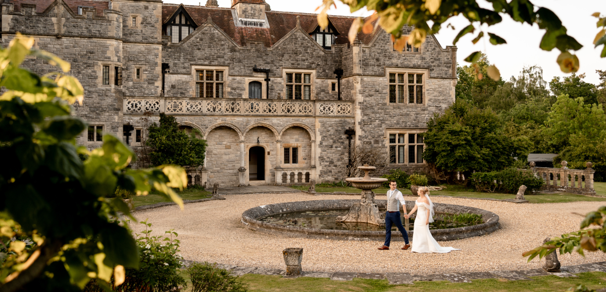 Rhinefield wedding venue exterior with couple