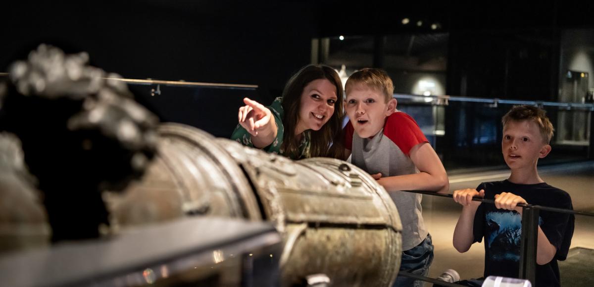 A family looks at the exhibits on display at the Mary Rose Museum in Portsmouth Historic Dockyard