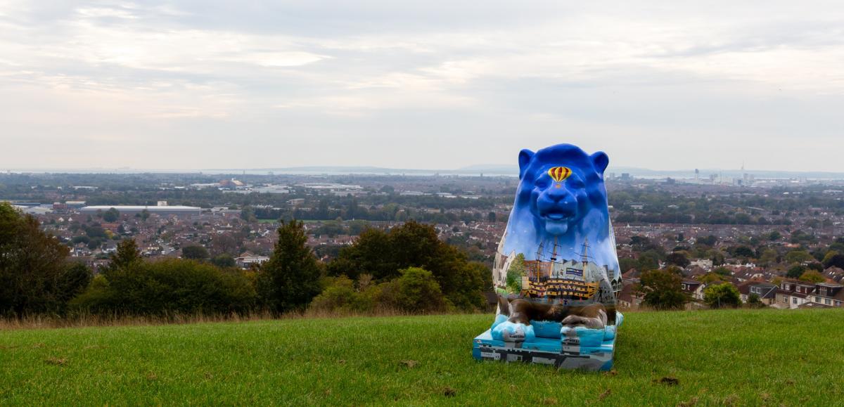 One of the lions for the Pride of Portsmouth art trail - Leonardo da Pompey by Bianca Braithwaite - atop Portsdown Hill with a view of the city behind.