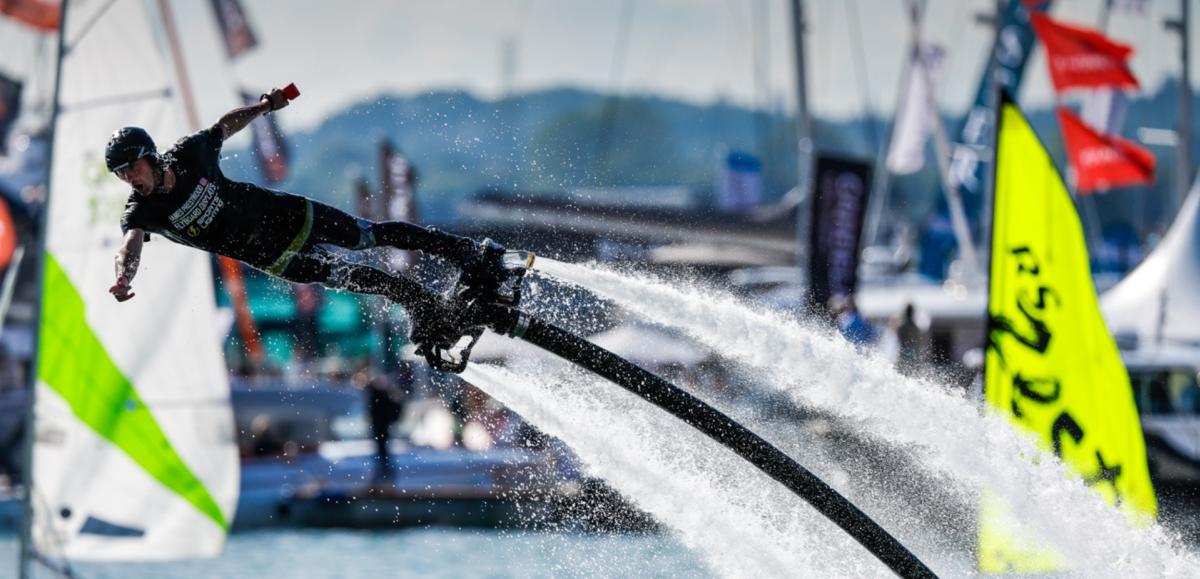 Man gliding on the water with water jet pack at Southampton International Boat Show