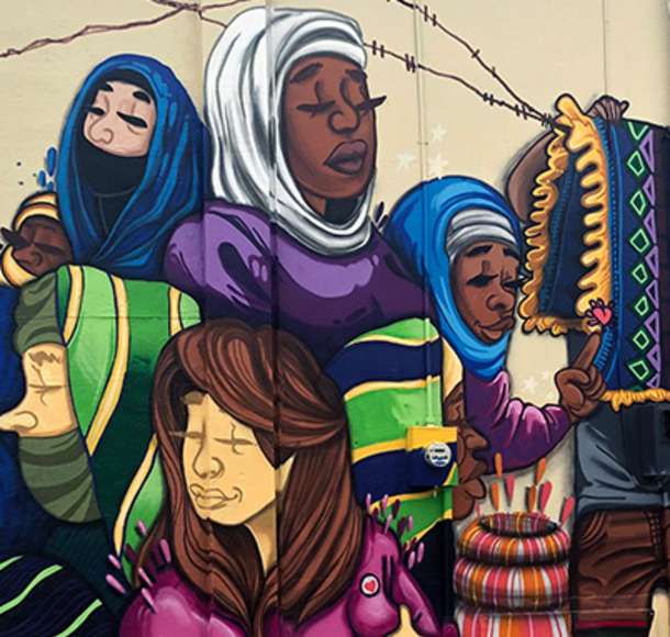Wall mural of different women and cultures in Overland Park