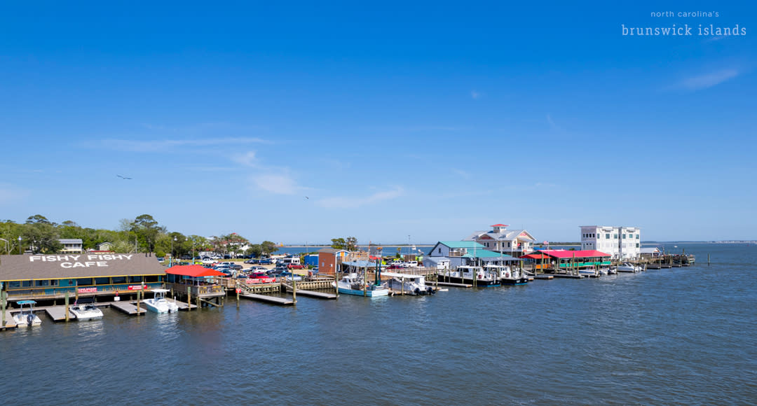 aerial view of a restaurants with boat access along a river