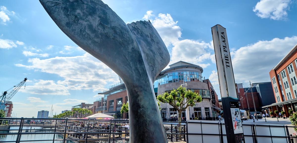 Close-up photograph showing the whale tail sculpture at Gunwharf Quays