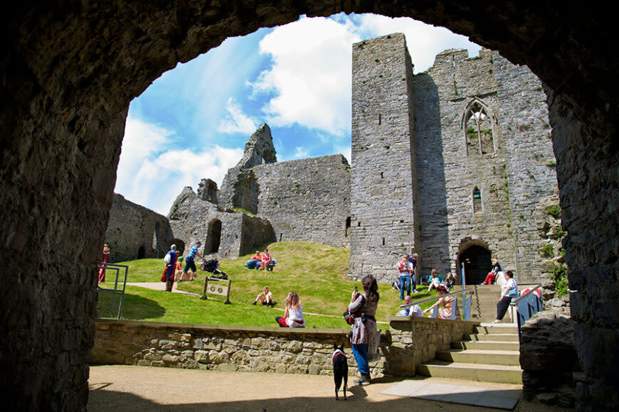 People inside the grounds of Oystermouth Castle.
