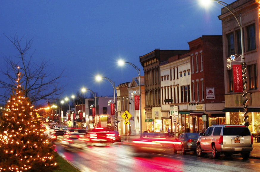 Downtown Canandaigua in the holiday season. Christmas tree adorning the street while cars move