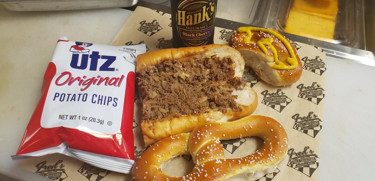 Photo of sandwich, pretzel and chips from Fred's Downtown Philly