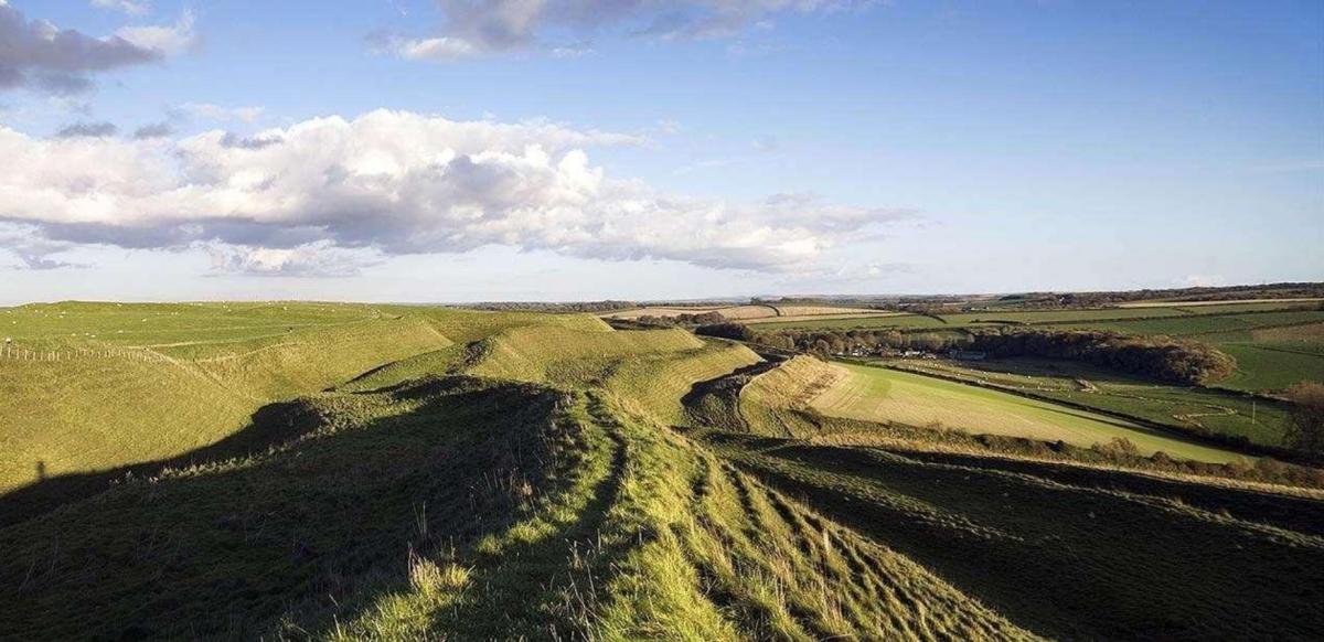 Maiden Castle, an Iron age hill fort near Dorchester. Photo copyright Historic England