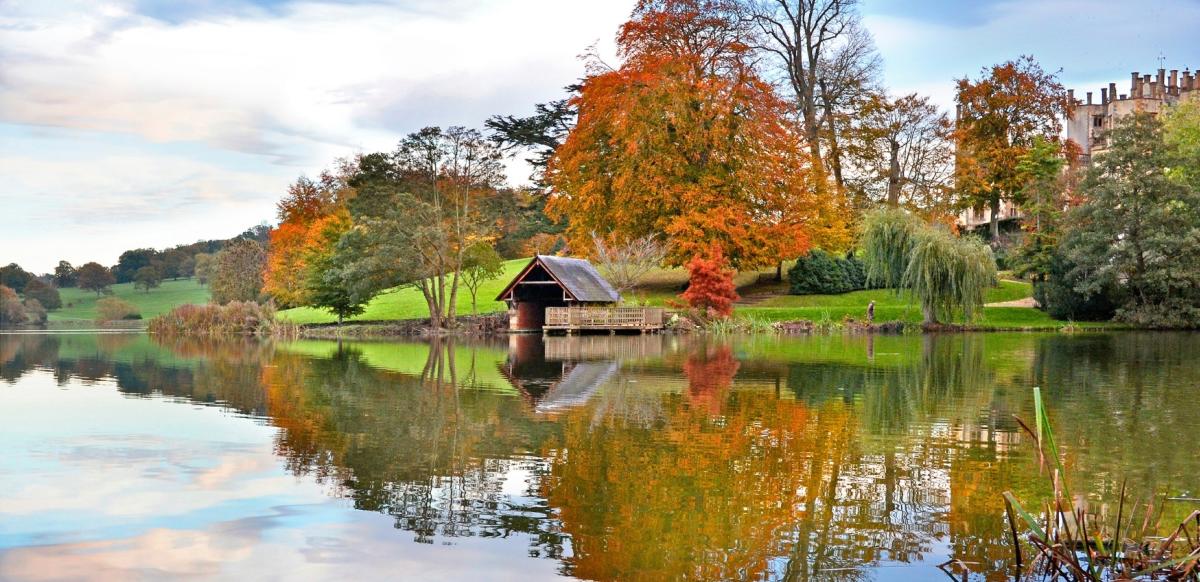 The boathouse and lake at Sherborne Castle, Dorset in autumn