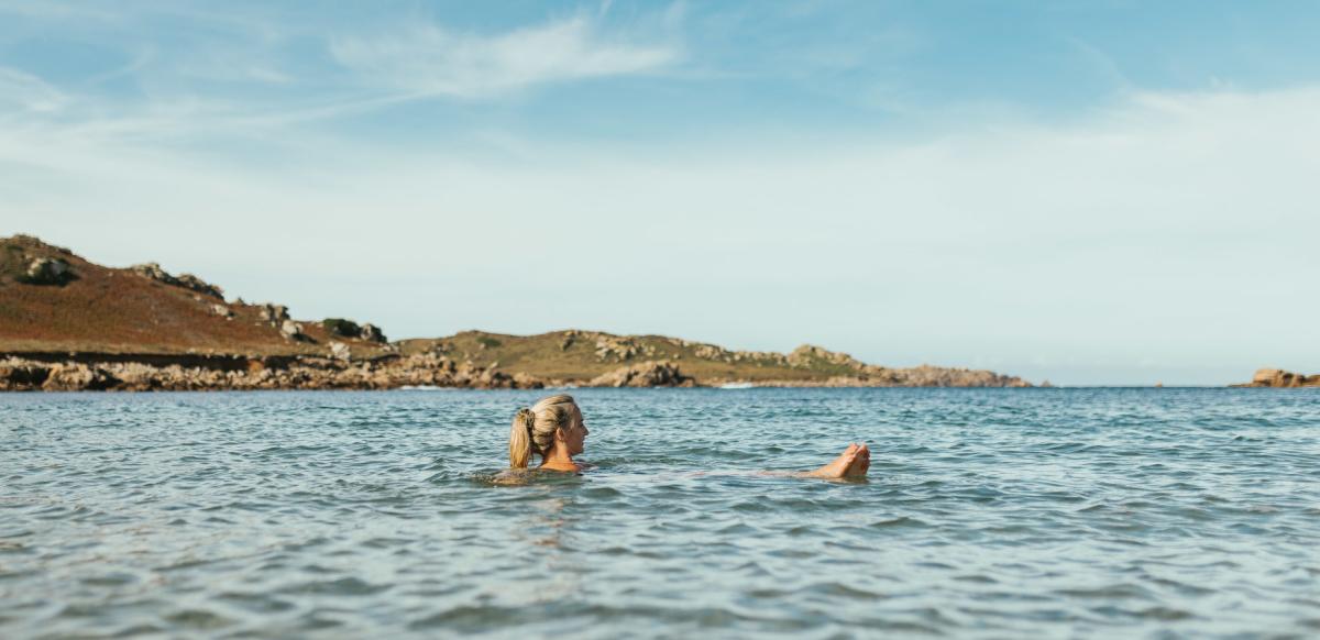 Woman swimming in Autumn