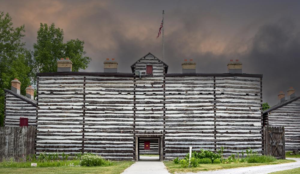 the exterior of the historic old fort with dark ominous sky