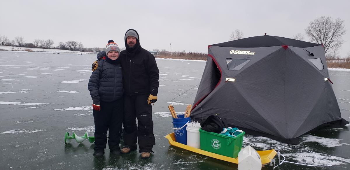 Father and Son Ice Fish on Lake Andrea in January