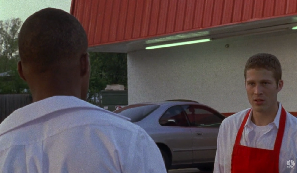 Friday Night Lights Screengrab of two men standing outside the Alamo Freeze