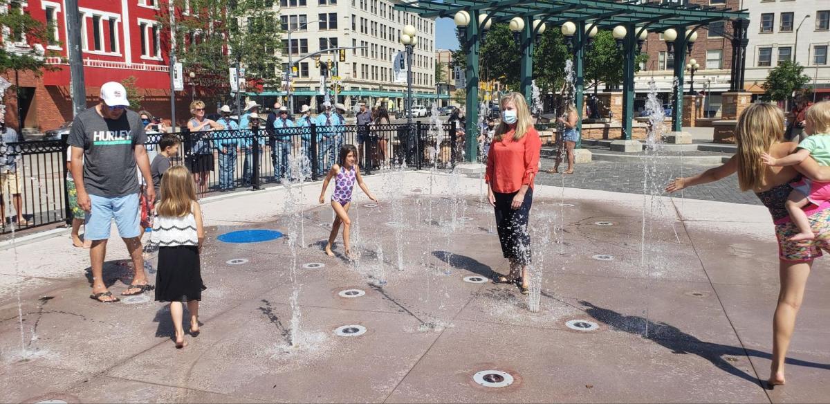 Children enjoying the Downtown Splash Pad, a perfect spot for kid-friendly things to do, offering fun and cooling play in Cheyenne.