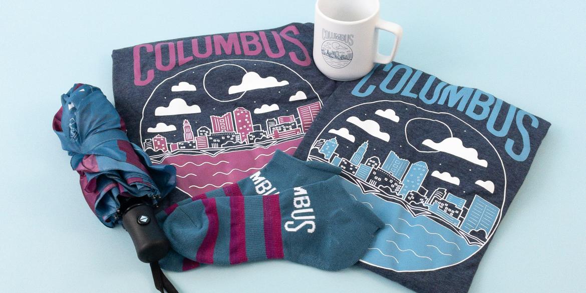 Merch as part of CBUS Rewards program, including Columbus shirts, mug, umbrella and socks