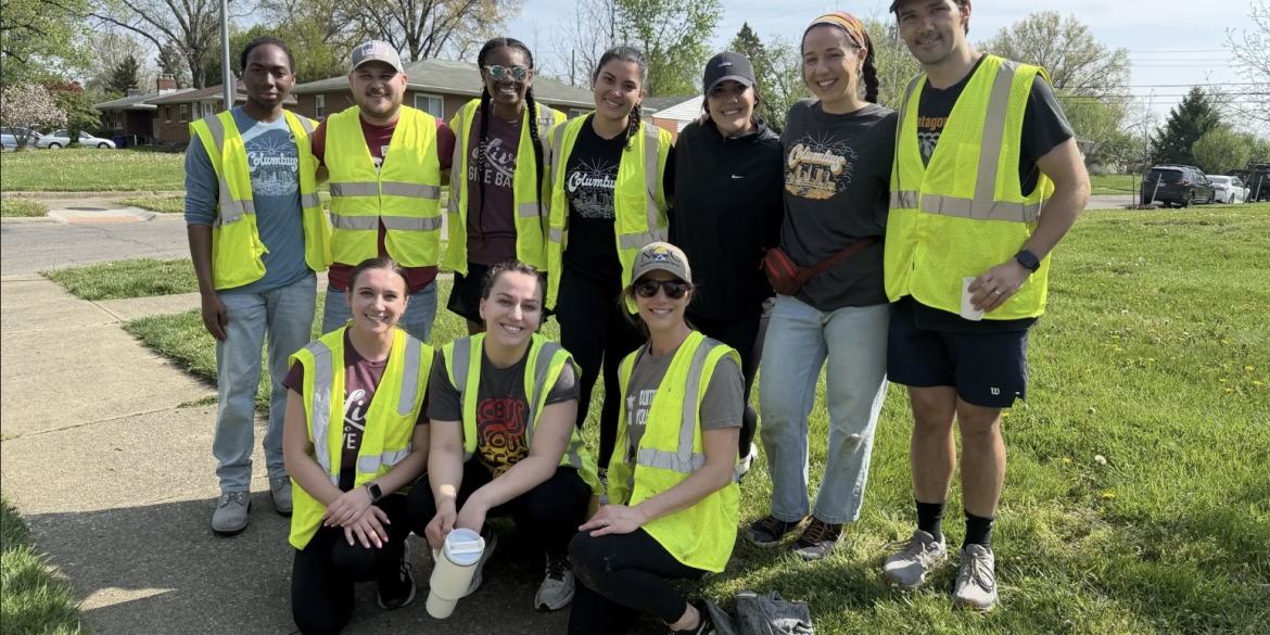 Group of people wearing safety vests during volunteer event