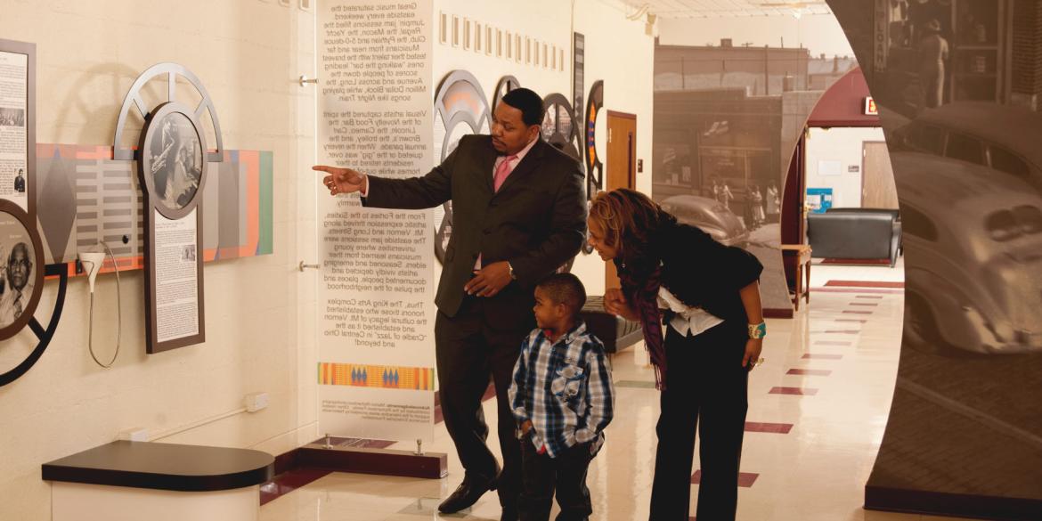 A family viewing art at the King Arts Complex