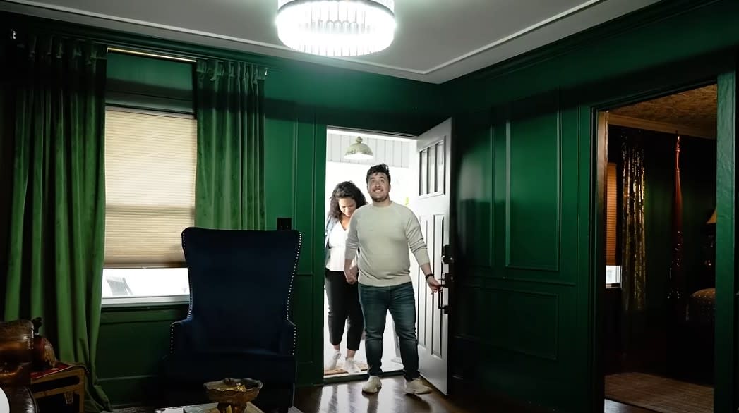couple entering an Airbnb cottage