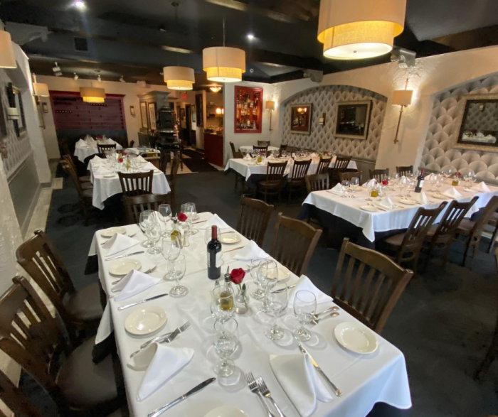 Dinner tables with plates and utensils 