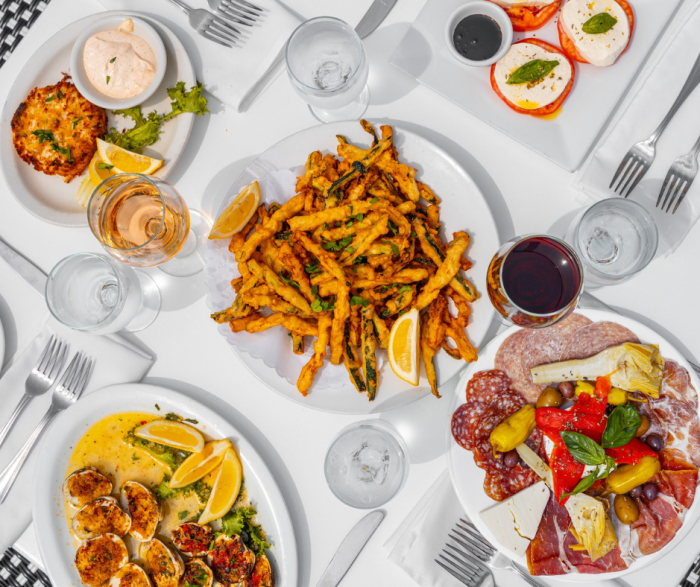 Multiple plates of food arranged neatly around each other.