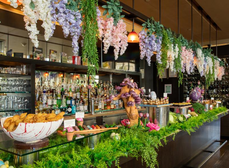 Easter desserts on display with floral decorations