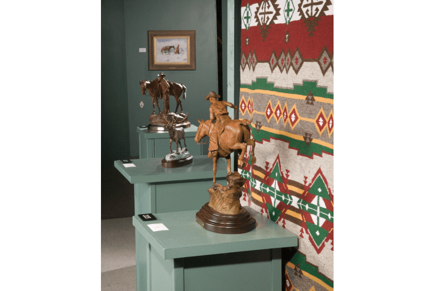 A photo of the Frontier Days Old West Museum in Cheyenne, Wyoming, on a snowy winter day. The museum is a collection of historic buildings and artifacts from the American Old West.