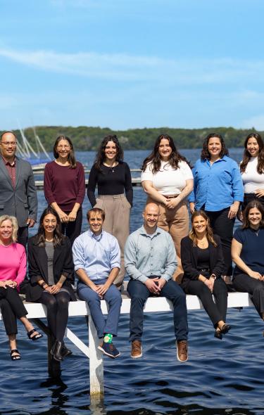 A group of sales professionals from the Destination Madison Team near Lake Mendota