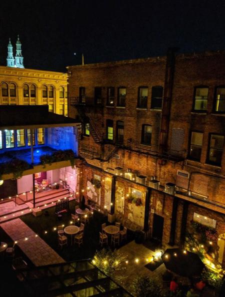 aerial view of the patio at hotel covington in the dark with lights strung across