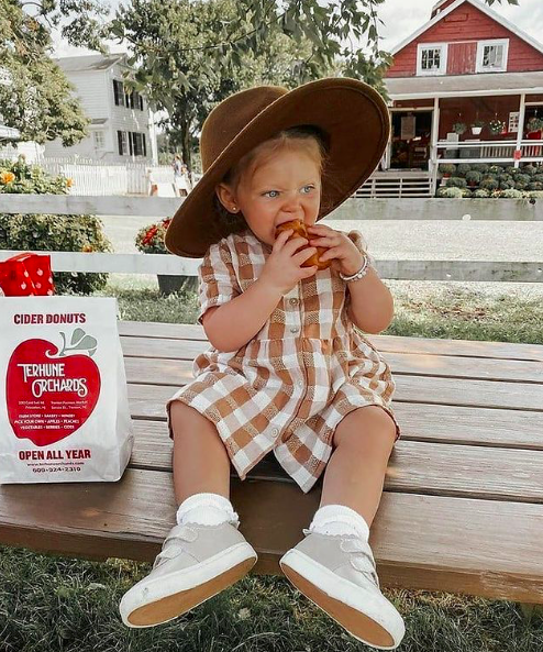 Young child eating an apple at Terhune Orchards