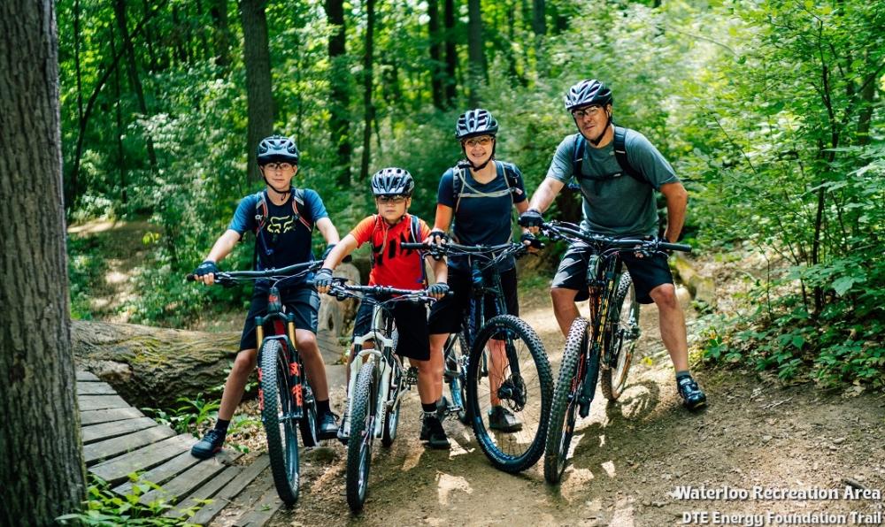 Family biking the DTE Energy Foundation Trail