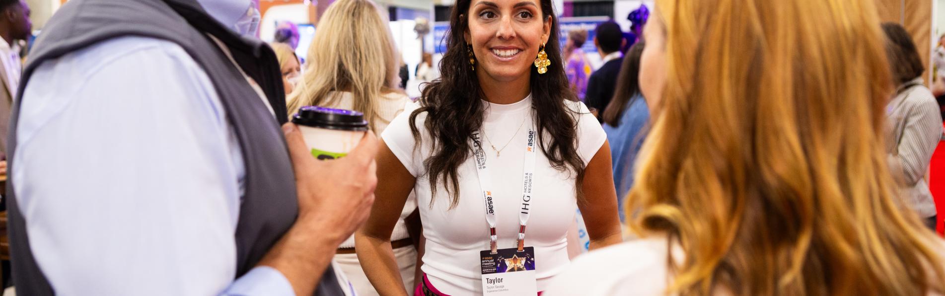 Three people converse at Experience Columbus Client Event at Los Angeles Convention Center during ASAE's 2025 Annual Meeting.