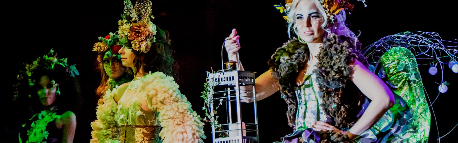 Women wearing extravagant Halloween costumes