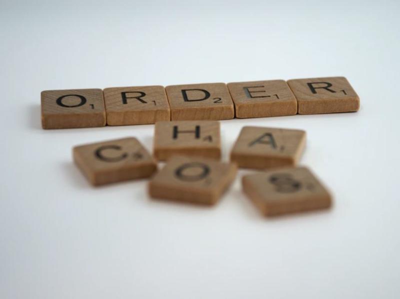 Scrabble tiles that spell Order and Chaos