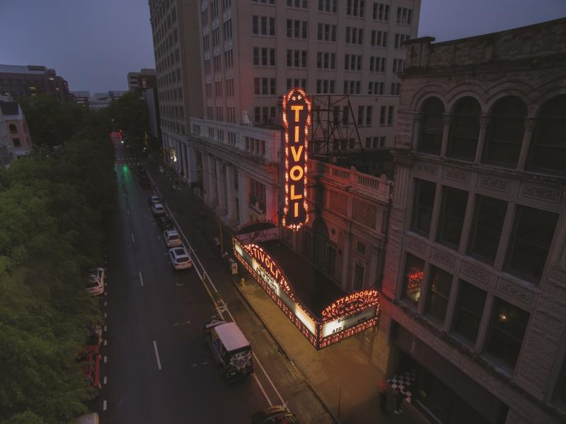 Aerial of Tivoli sign lit up in late evening