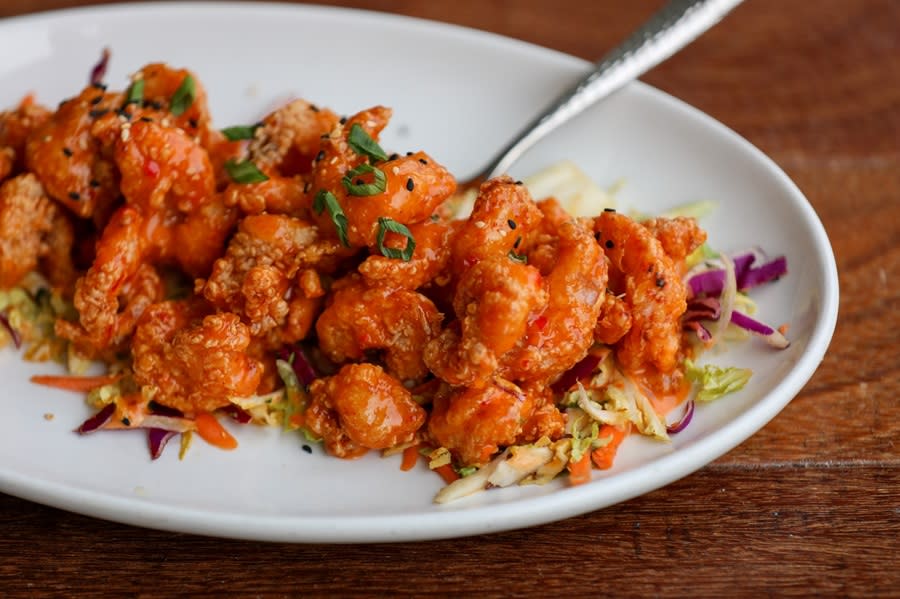 An oval dish filled with shrimp