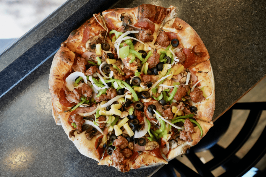 Jack's Combo Pizza withmozzarella, pepperoni, Canadian bacon, Italian sausage, fresh mushrooms, black olives, pineapple, fresh white onions, and fresh green peppers