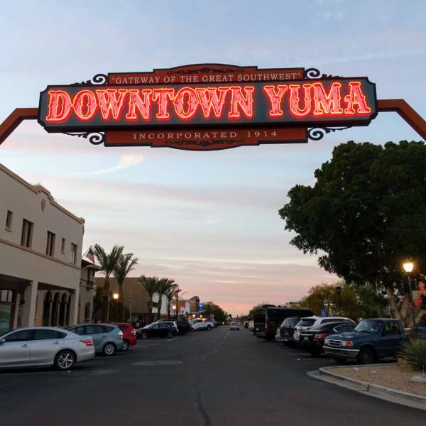 Downtown Yuma sign lit at twilight