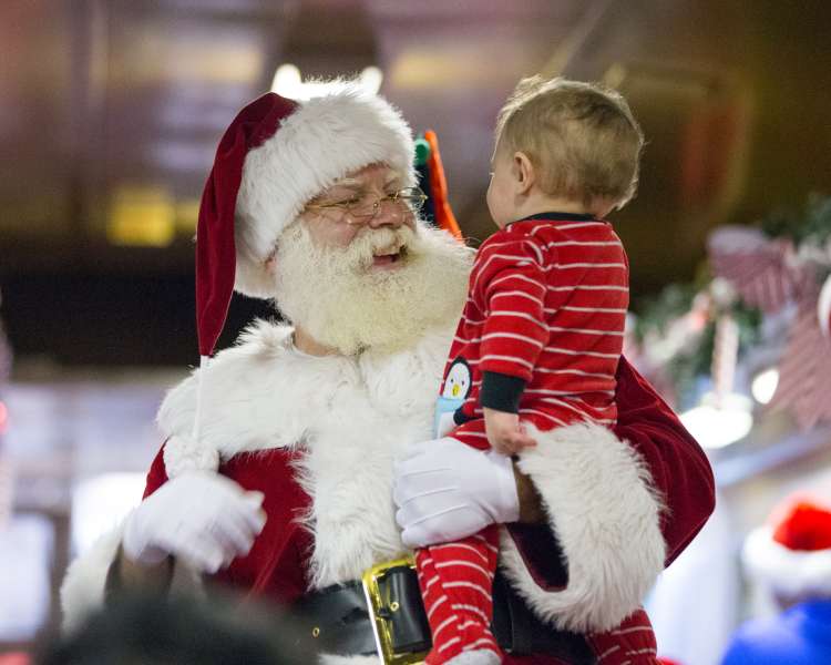 Santa with a child on the Polar Express train in Rhode Island