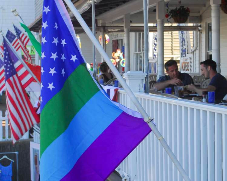 Flags hanging from the patio at The Harbor Grill.