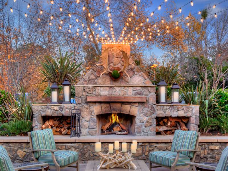 Outdoor seating area with market lights.