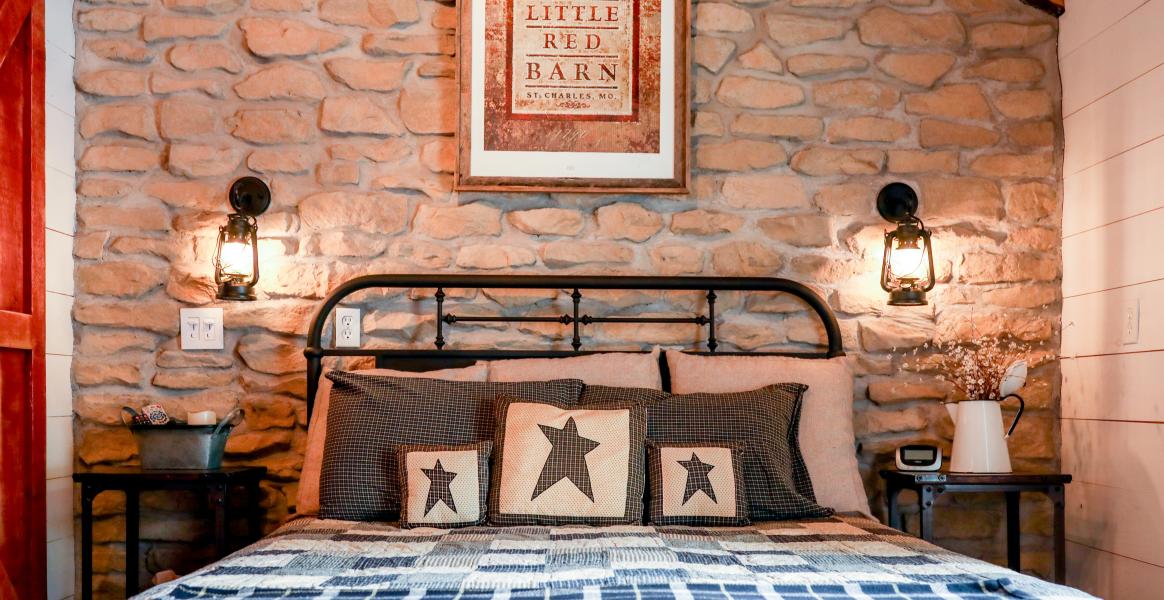An inviting bed in a guest room at the Red Barn Guest House in St. Charles, MO.