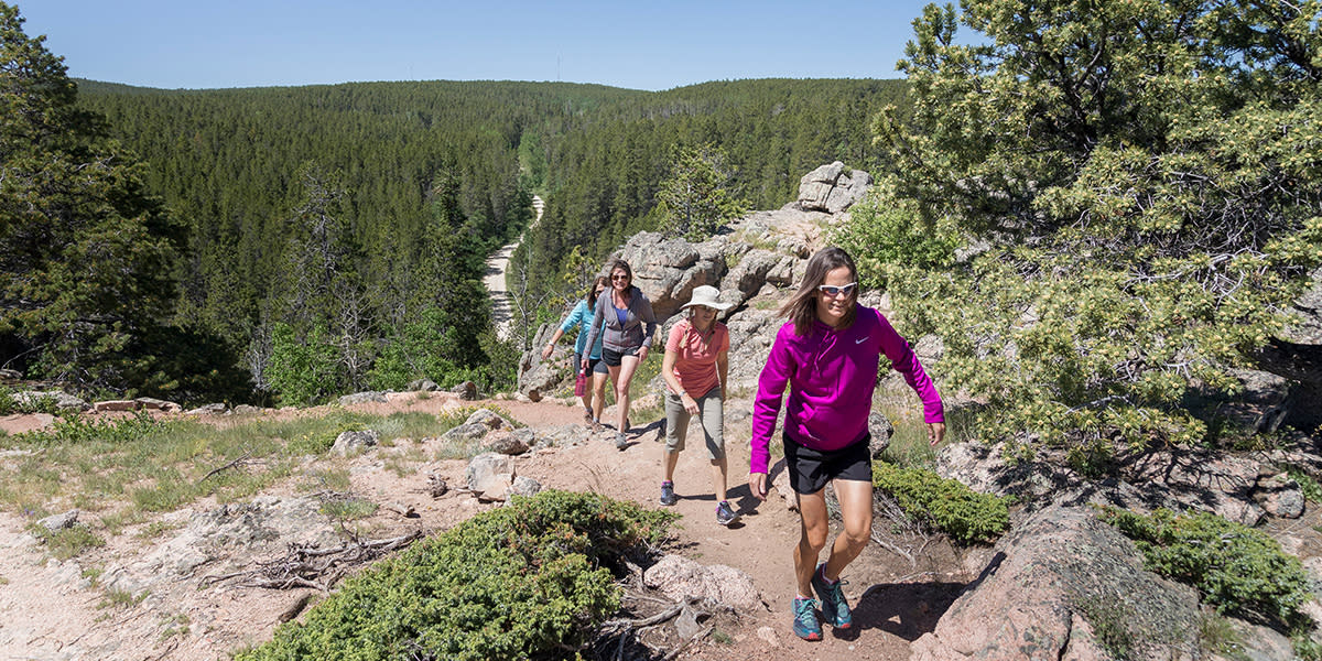 Women hike a trail on Casper Mountain in Casper, WY