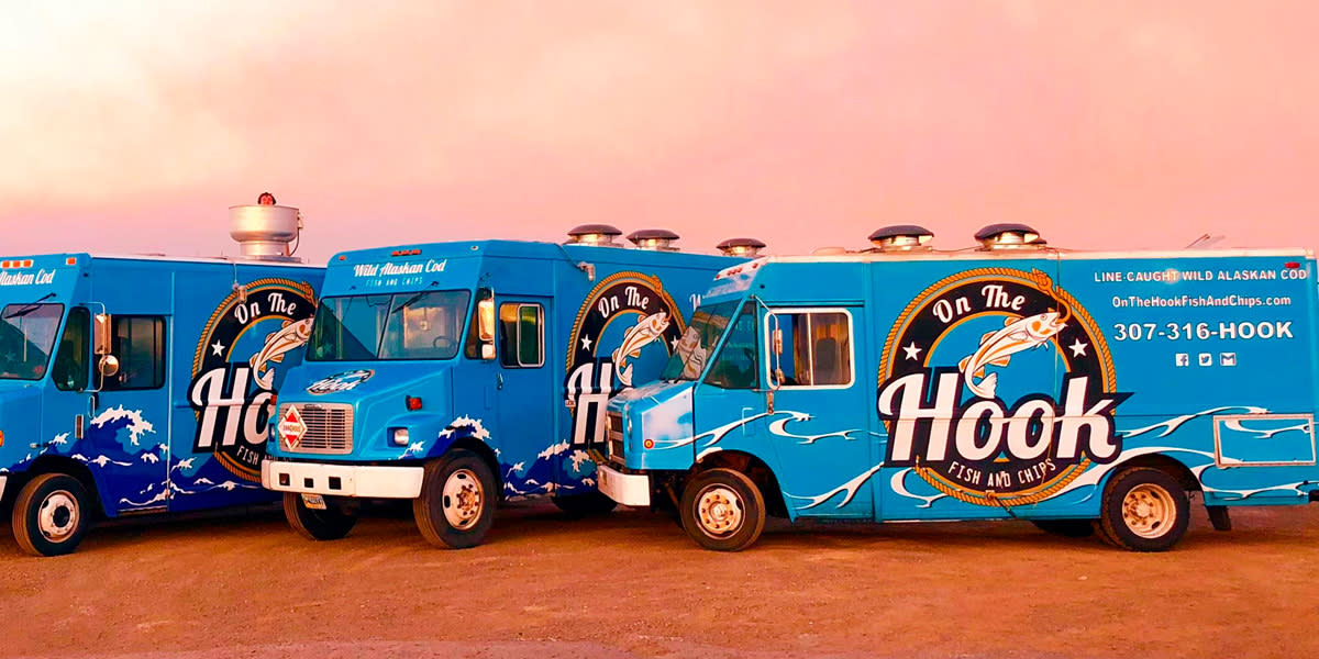 On the Hook food trucks against a pink sky in Casper, WY