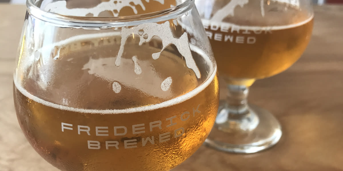 A beer in a glass that says Frederick Brewed