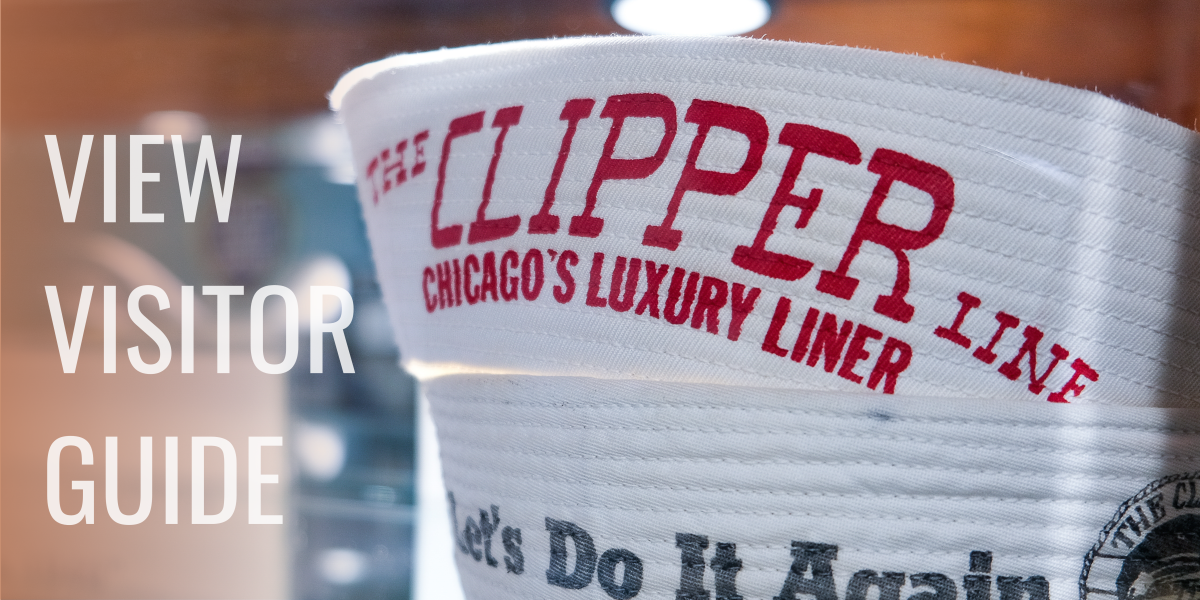 white sailor hat with red clipper logo. text to left reads view visitor guide