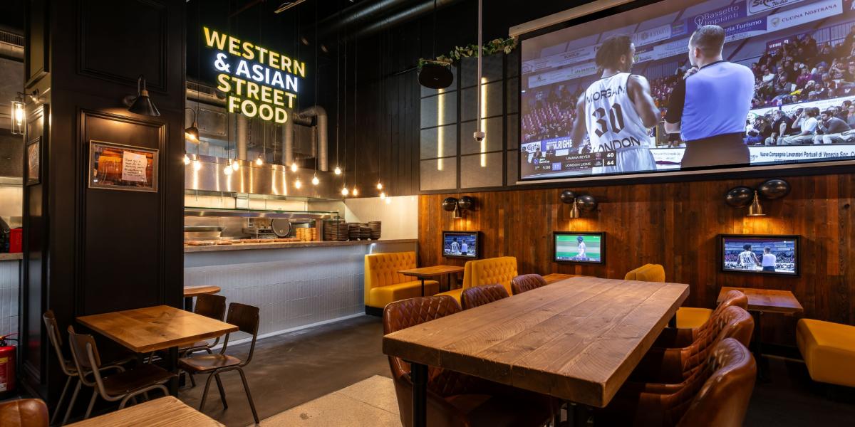 Kwackers Restaurant dining area with big sports screen