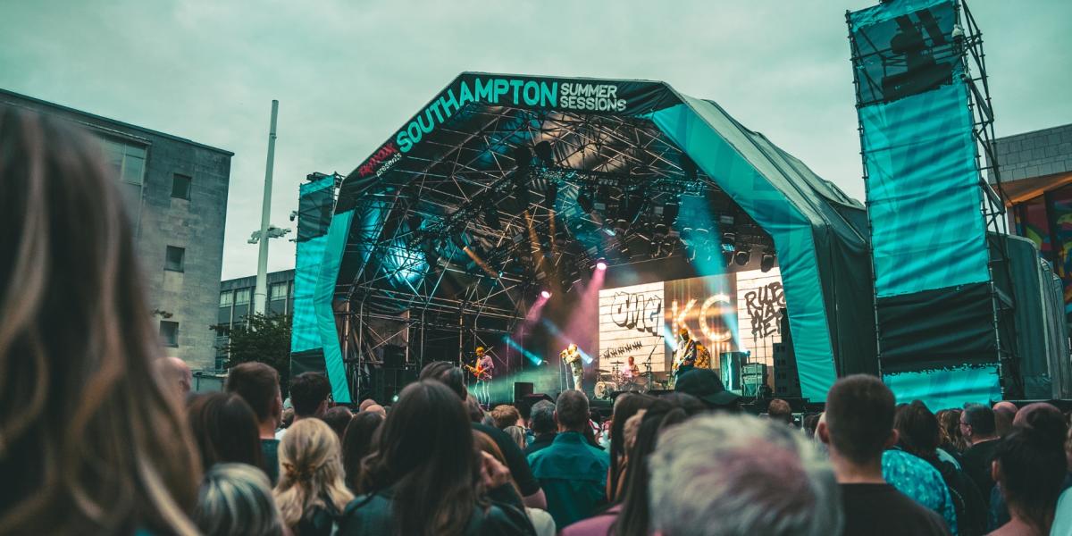 Large crowd watching Kaiser Chiefs perform lives onstage in Guildhall Square for Southampton Summer Sessions