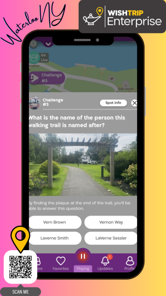 Wishtrip app pulled up on an image of a phone in front of a pink and yellow background.