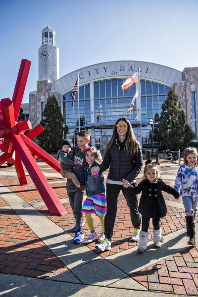 family in front of city hall