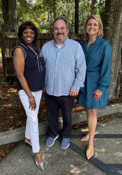 All The Waves Podcast hosts Zondra and Katie stand on either side of guest Jason Leader, Executive Director of 30 by Ninety Theatre.