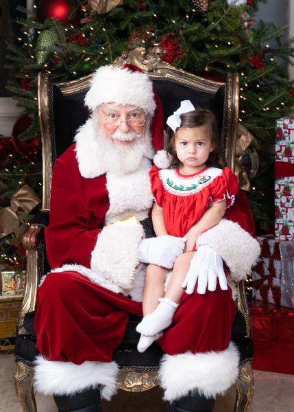 Southern Hotel's Santa Claus with staffer's daughter Sandy, who's vying for the Naughty list